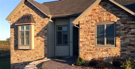 metal siding with stone on house|solid stone siding for homes.